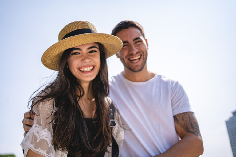 Couple holding and bonding while on a walk outdoors